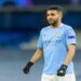 MANCHESTER, ENGLAND - APRIL 06: (BILD ZEITUNG OUT) Riyad Mahrez of Manchester City looks on during the UEFA Champions League Quarter Final match between Manchester City and Borussia Dortmund at Manchester City Football Academy on April 6, 2021 in Manchester, United Kingdom. Sporting stadiums around the UK remain under strict restrictions due to the Coronavirus Pandemic as Government social distancing laws prohibit fans inside venues resulting in games being played behind closed doors. (Photo by Vincent Mignott/DeFodi Images via Getty Images)