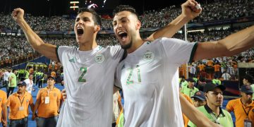 Algeria's Aissa Mandi and Ramy Bensebaini celebrate after winning the Africa Cup of Nations