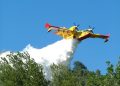 Ascoli Piceno, Italy - July 21, 2006: Canadair in action on the hills of the Marche, in Italy, while extinguishing a fire in a forest. The canadair is a propeller plane and is able to take a great quantity of water from the sea or even from a lake and to throw on the fire with precision